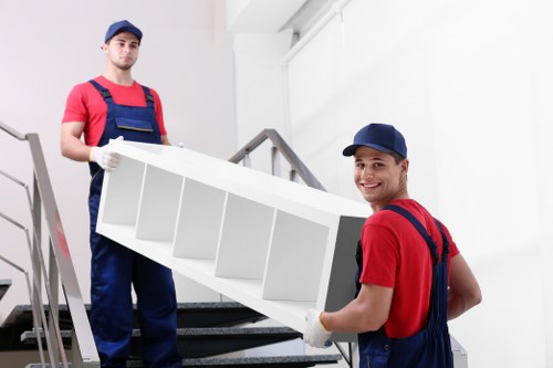 Professional removals and storage services in Tulsehill with moving boxes and furniture